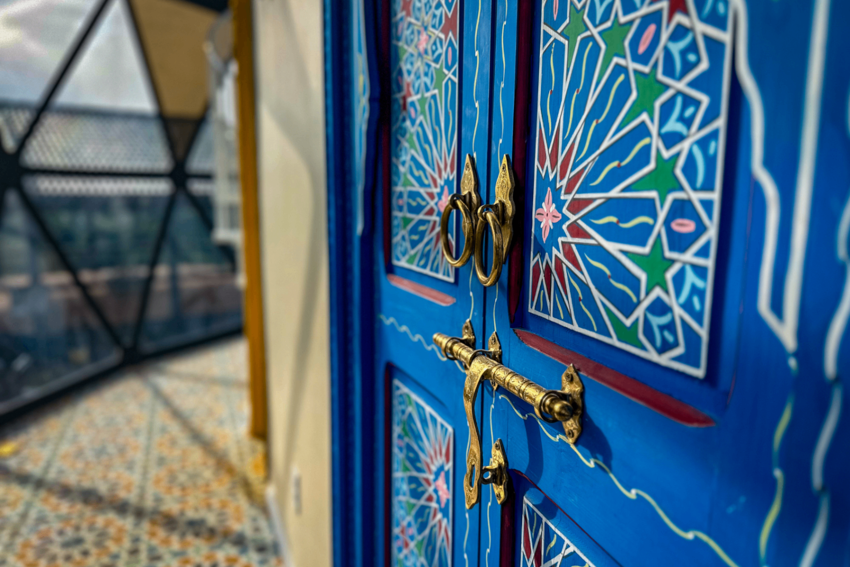 Moroccan blue door and tilework detail at the Chefchaouen Dome