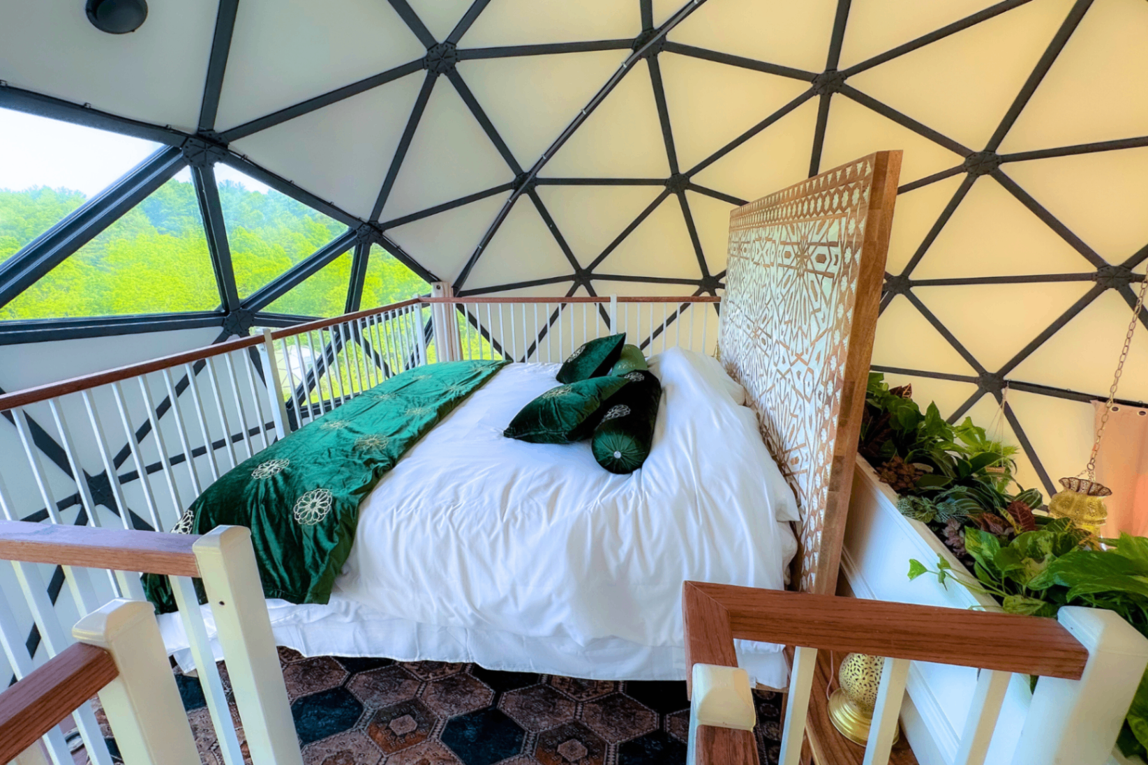 Fes dome bed seen wide from the mezzanine, showing the full geodesic ceiling