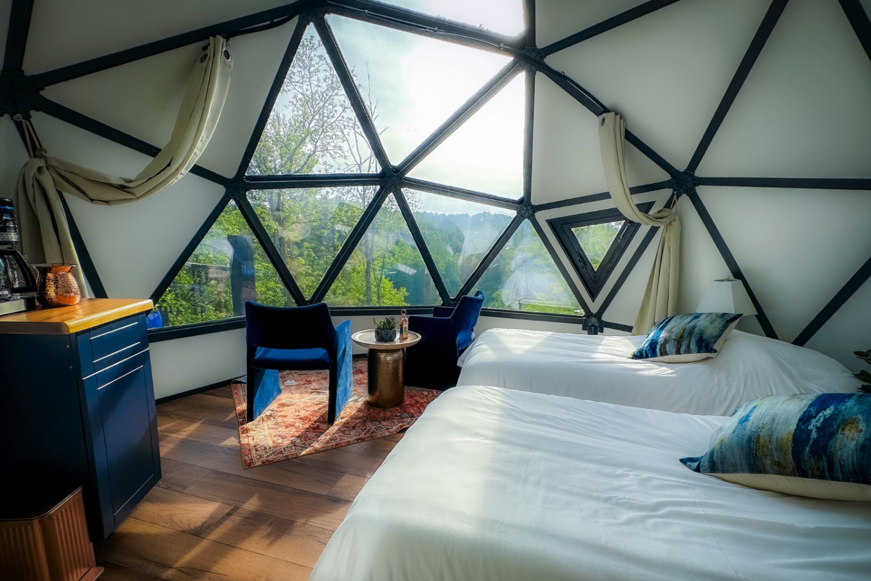Chefchaouen dome — twin beds with blue watercolor pillows and mountain view