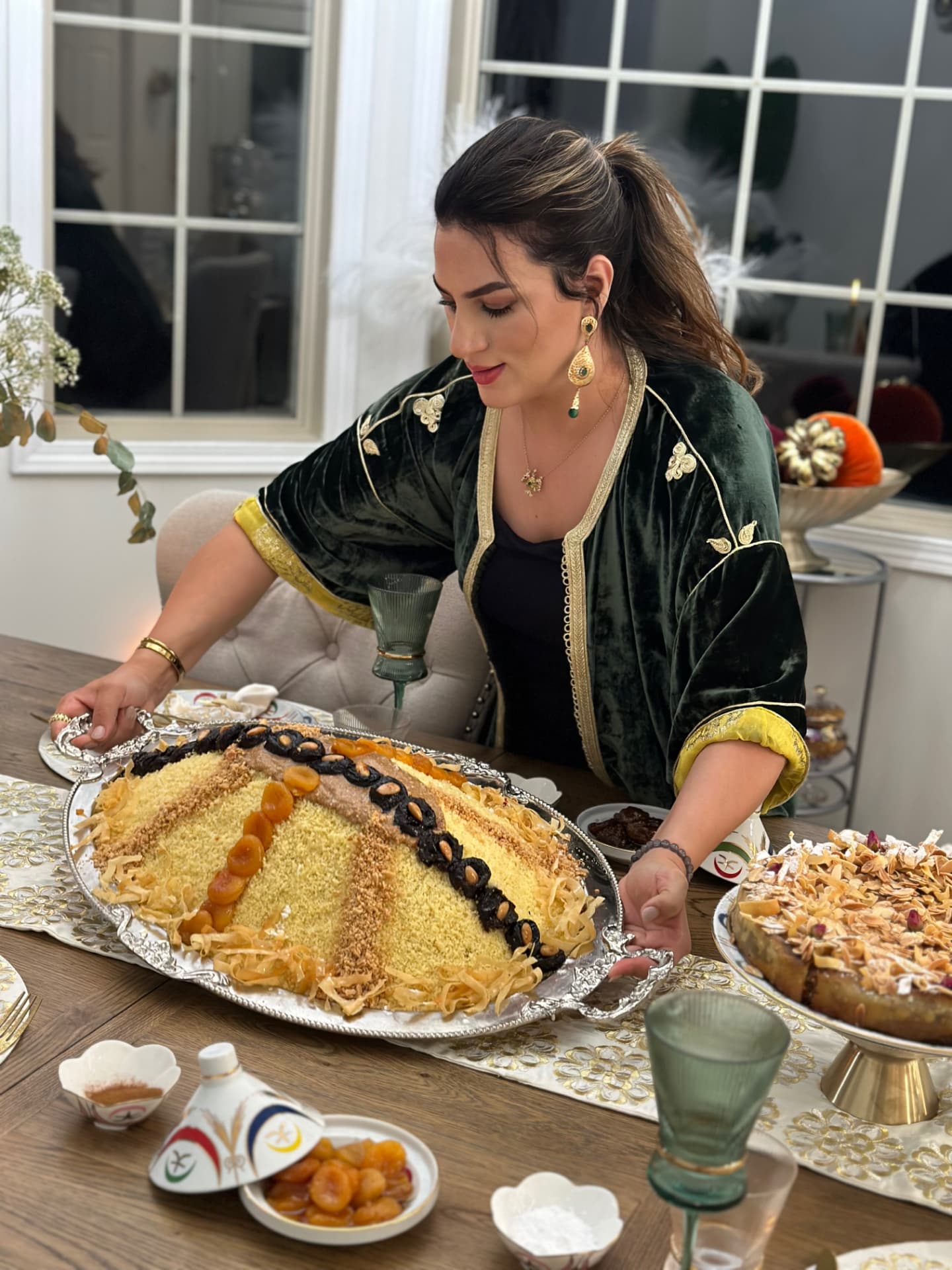 Chef Nadia Labdaoui presenting a traditional Moroccan couscous at Nadia's Table