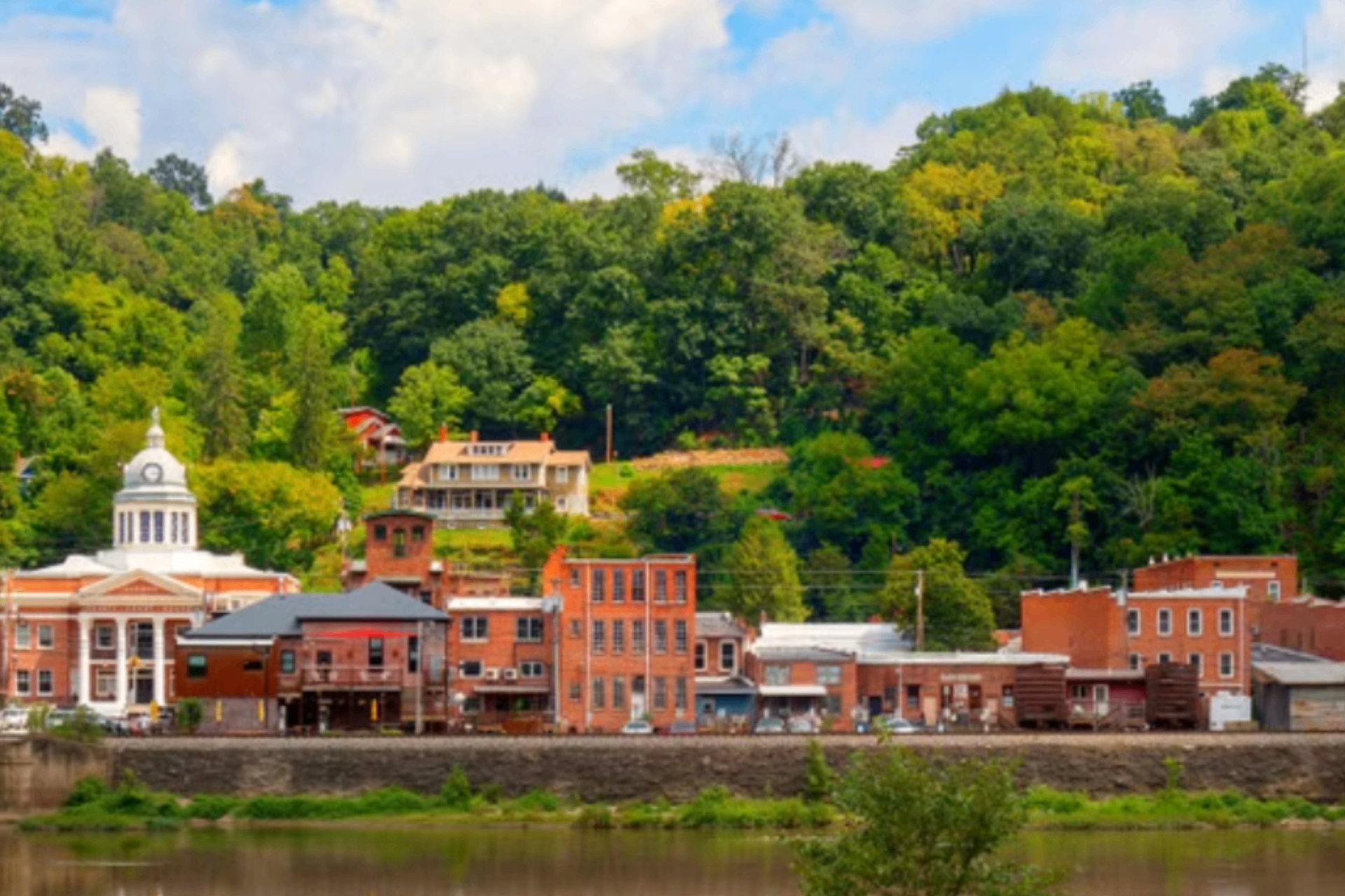 Downtown Marshall, a riverside mountain village with brick buildings and a historic courthouse