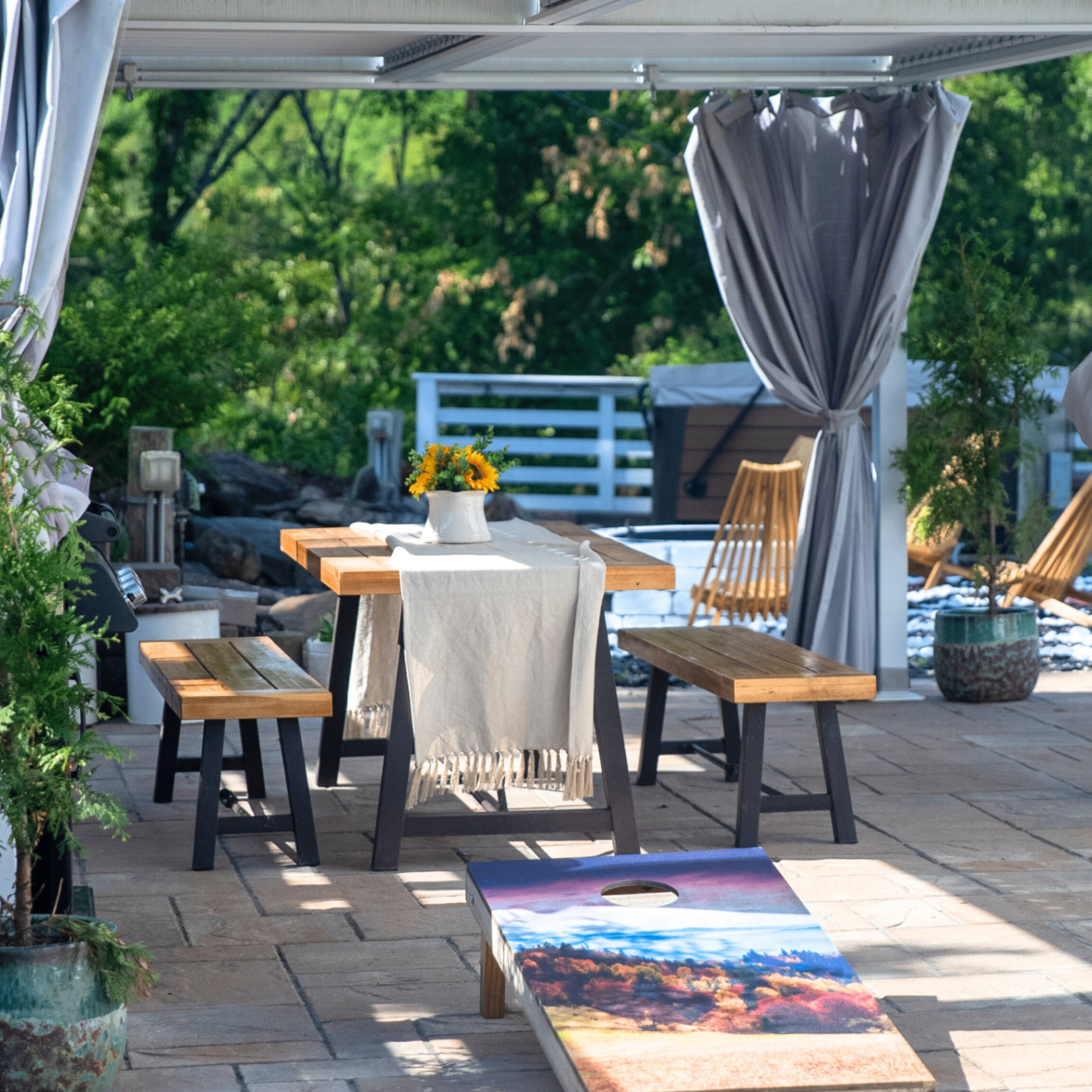 Pergola dining table with sunflowers on the patio