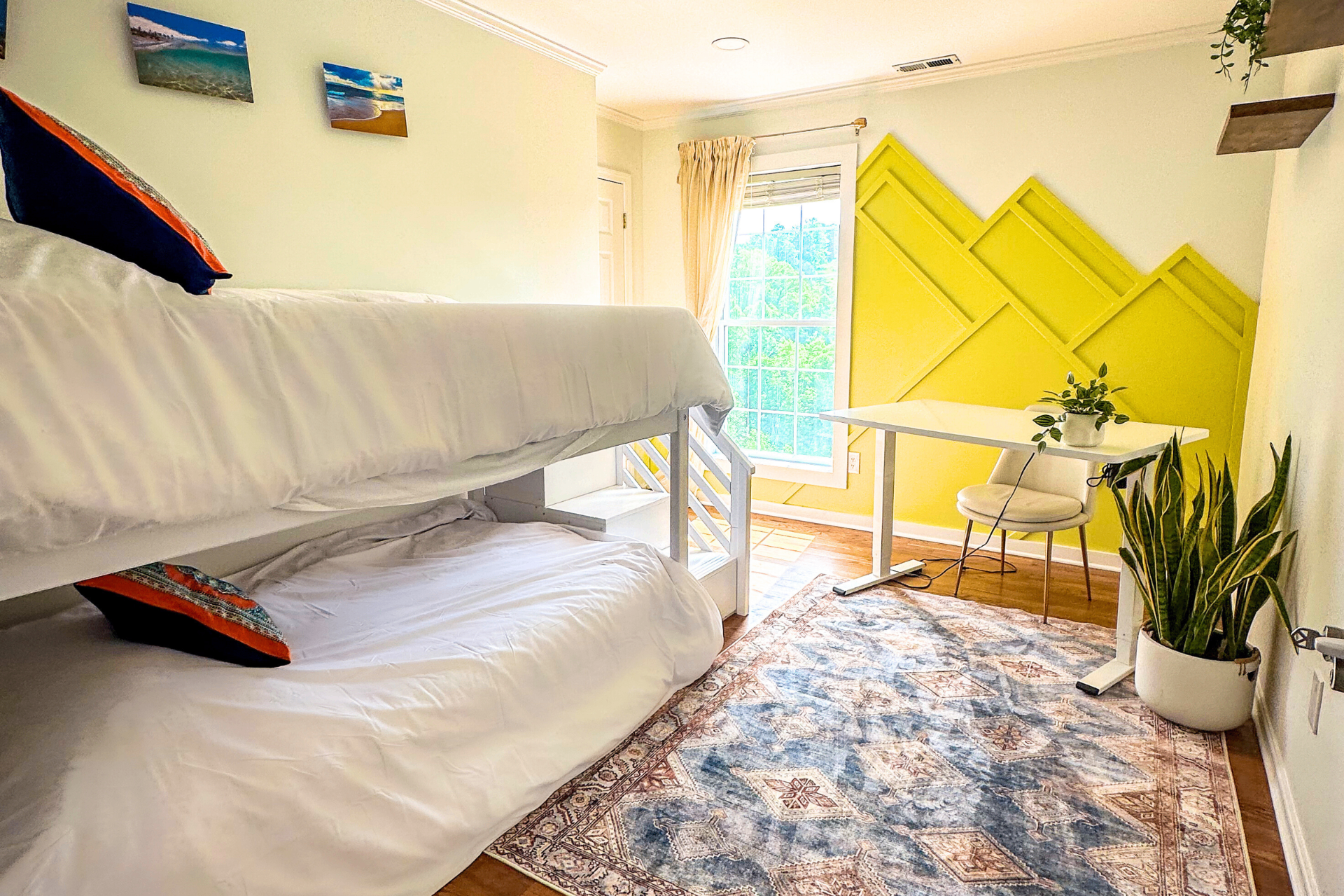Meadow Room with white bunk beds and yellow mountain-shape accent wall