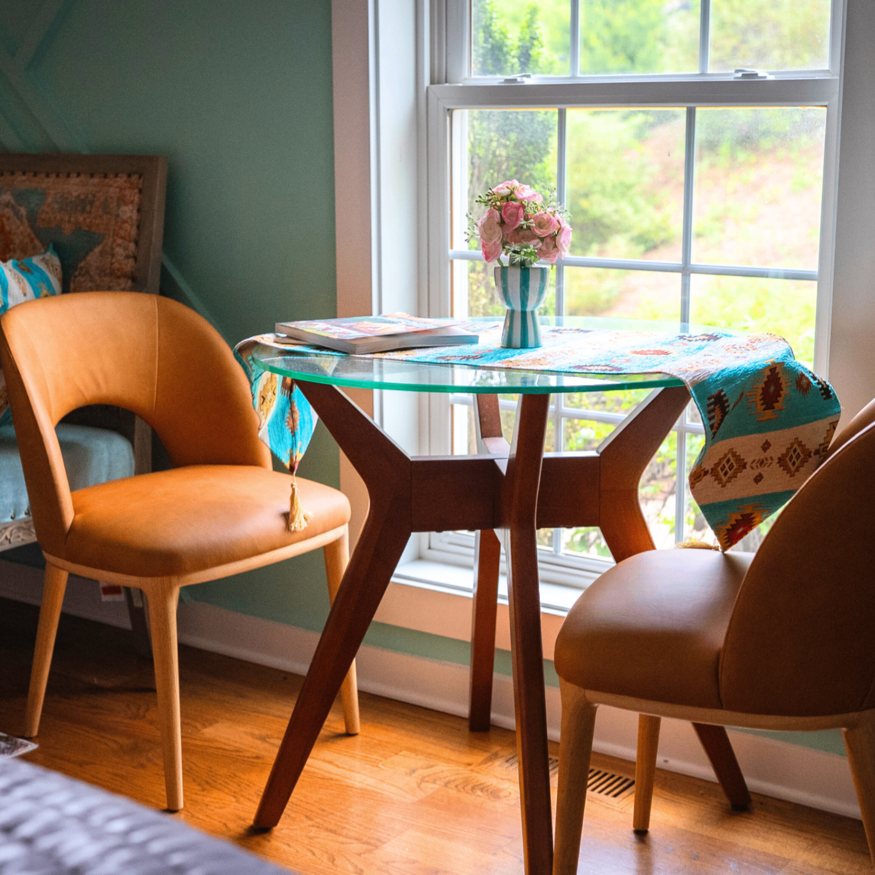 Bistro table for two beside a sunlit window