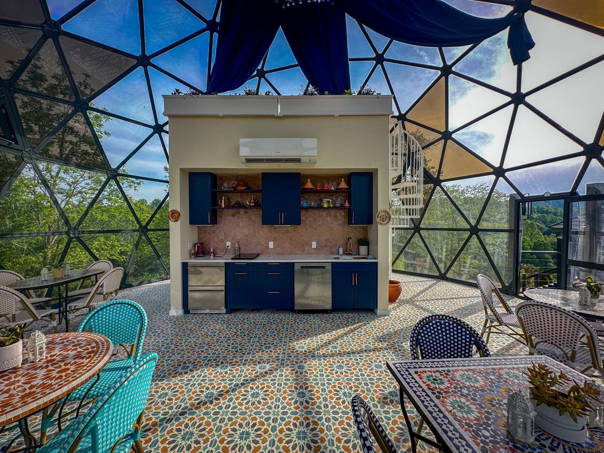 The Medina Tea House kitchen dome with mosaic tiles and blue cabinetry